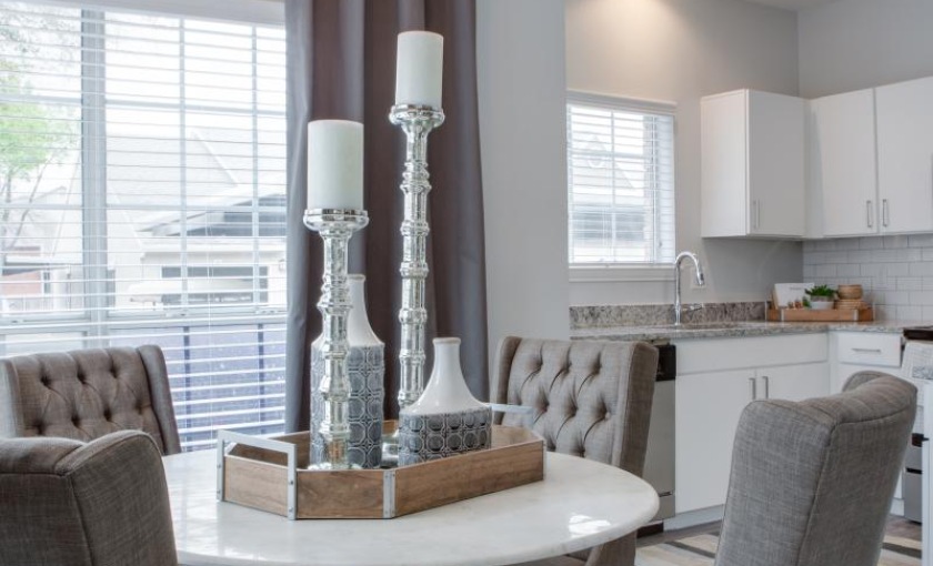 a kitchen with a table and chairs